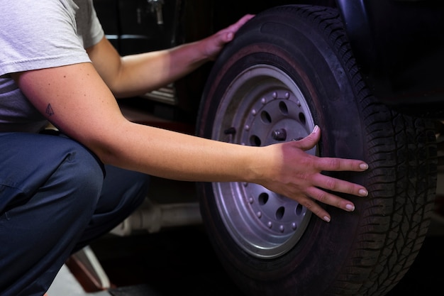 mechanic checking car suspension