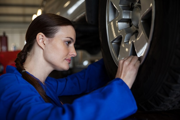 Toyota sedan on a lift for wheel alignment