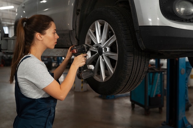 wheel alignment machine adjusting a car's suspension angles